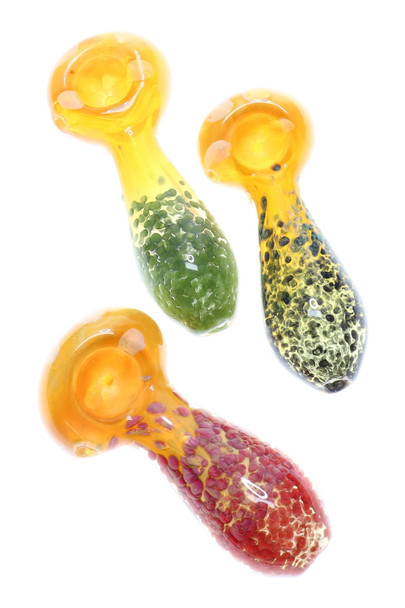 Trio of 4" gold-fumed color-changing frit glass spoon pipes in red, green, and black frit; overhead studio angle for wholesale head-shop catalogs.