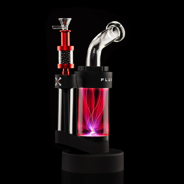 Red Pike tar filter mounted on an illuminated plasma water pipe, retail smoke accessory demo, close side view with glass bowl attached. Red Pike tar filter mounted on an illuminated plasma water pipe, retail smoke accessory demo, close side view with glass bowl attached.