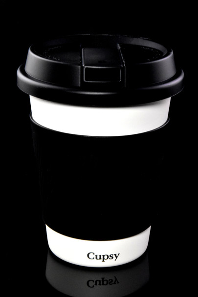 Cupsy disguised water pipe with closed black lid and white cup body, straight-on studio angle—retail smoke shop novelty.