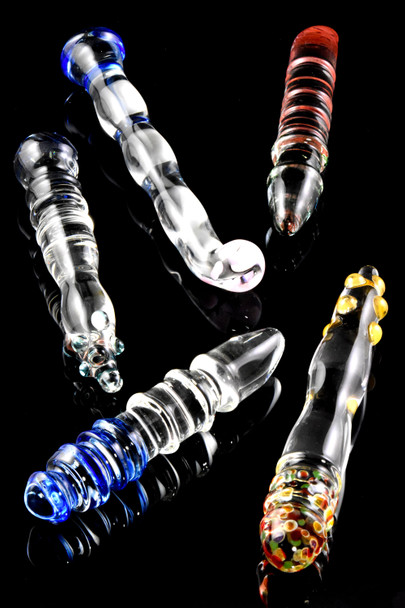 Assorted US-made large glass adult toys, 6–8", mixed colors and textures on black background, wholesale front angle.