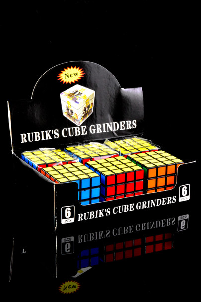 Classic color-block Rubik’s Cube grinders in a 6-piece retail tray; wholesale display image with front row visible.