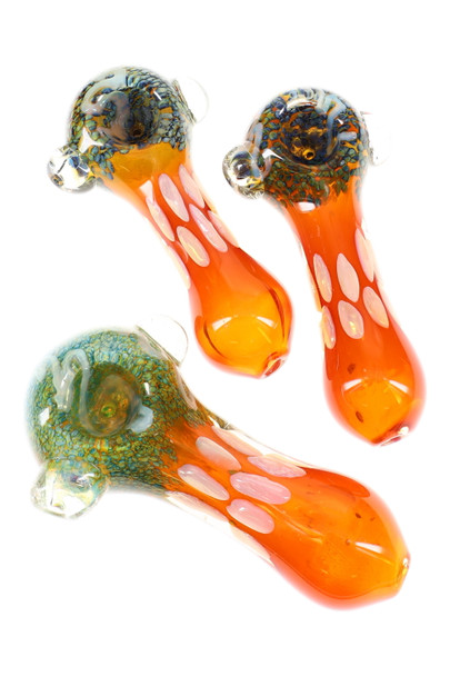 Three 5" gold-fumed color-changing glass spoons with orange bodies, frit bubble bowls, and clear marble grips; wholesale head-shop image, angled top view.