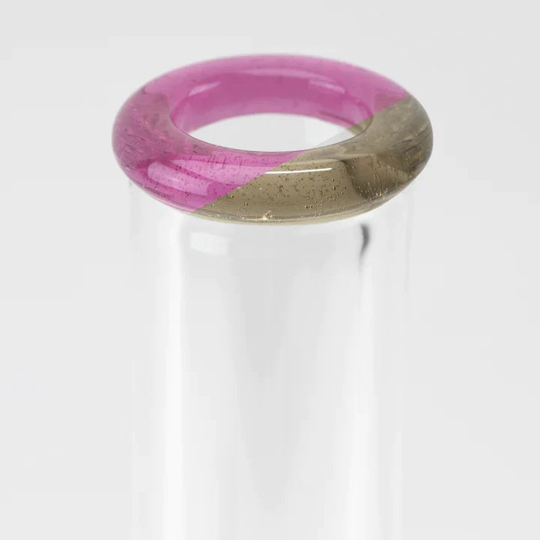 Magenta/gray split lip close-up on clear beaker neck; crisp sandblasted floral pattern for head-shop buyers.