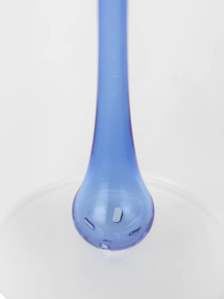 Macro of ocean-blue percolator drop with slotted holes inside clear chamber; gradient-frosted body detail for wholesale head-shop listings, close view.