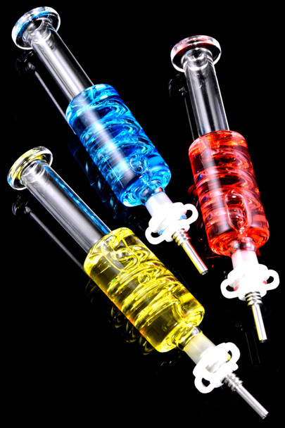 Red, blue and yellow colored freezable coil glass dab straws with metal tip.