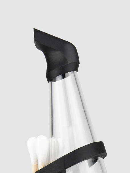 Angled mouthpiece close-up; black silicone Peak Pro tip on clear glass top, accessory detail for wholesale head shops. Angled mouthpiece close-up; black silicone Peak Pro tip on clear glass top, accessory detail for wholesale head shops.