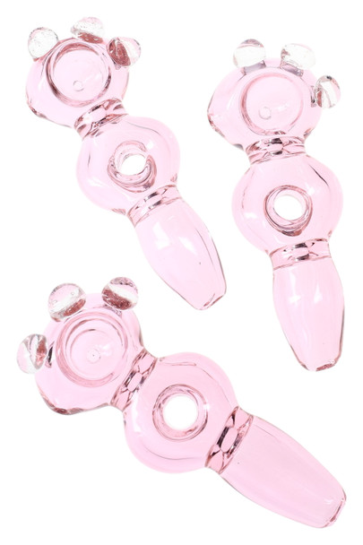 Trio of 5" pink clear-glass donut-hole spoon pipes with three clear marble accents, studio top view—ideal for wholesale smoke shop case displays.