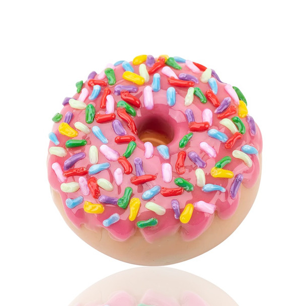 Overhead view of donut pipe highlighting glossy pink frosting and recessed mouth opening; showcase novelty for retail smoke gear catalogs, 2.5" diameter.