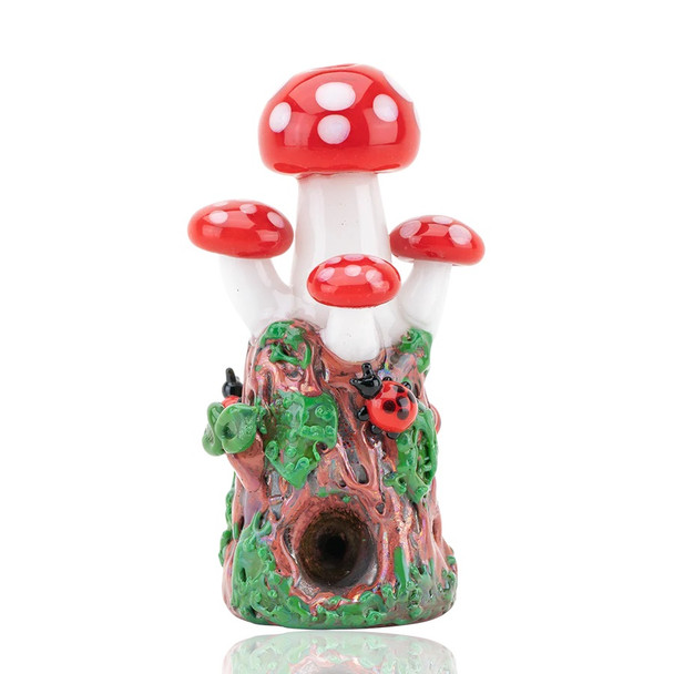 Straight-on product cutout of red-cap mushroom dry pipe with reflective base; worked borosilicate hand pipe for retail smoke gear listings.