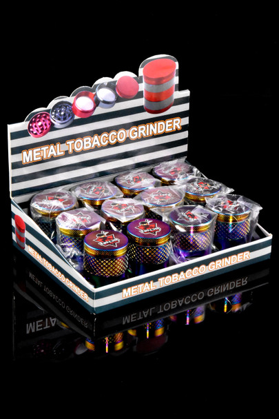 Shelf-ready display box of twelve rainbow Ninja windowed 1.5 in metal grinders; retail counter presentation for bulk purchasing.