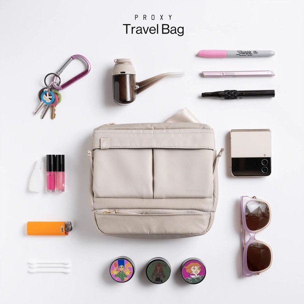 Desert Proxy Travel Bag flat-lay surrounded by everyday carry and Proxy accessories; retail smoke gear lifestyle setup.
