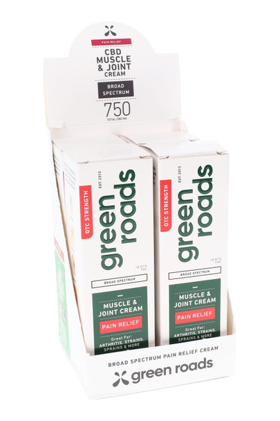 Retail-ready 4-pack display tray of Green Roads 750 mg Pain Relief CBD cream, white/green branding, wholesale counter unit, angled front view.