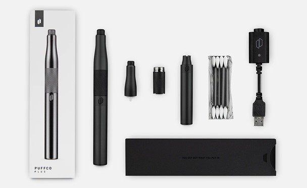 Complete Puffco Plus kit flat lay in Onyx: pen, Dart tip, chamber, swabs, USB-C charger, and case; wholesale-ready contents overview. Complete Puffco Plus kit flat lay in Onyx: pen, Dart tip, chamber, swabs, USB-C charger, and case; wholesale-ready contents overview.