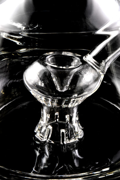 Close detail of GRAV Empress stemline with custom 8-cut perc inside clear beaker base; premium wholesale water pipe feature shot for head-shop listings.