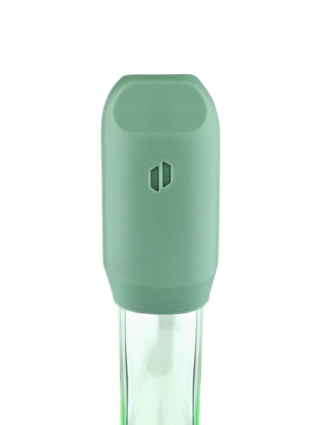 Macro of Flourish green silicone mouthpiece cover on glass stem; protective cap detail for wholesale head-shop accessory product pages.