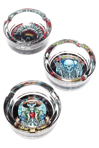 Wholesale trio of 3.25-inch tempered glass ashtrays featuring skull and gear artwork, overhead studio shot