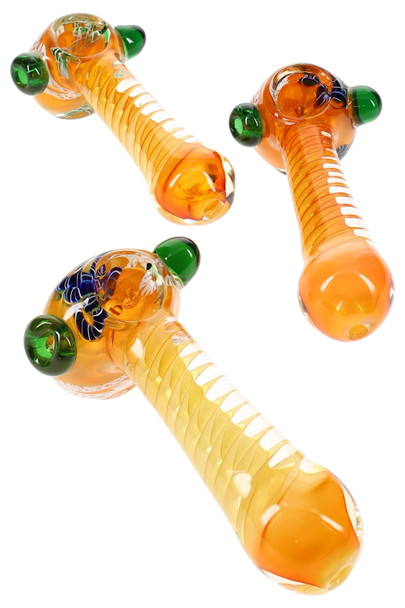 Three 5" gold-fumed glass hammer pipes for wholesale displays, orange/yellow spiral stems with green marble accents, top-down studio layout.