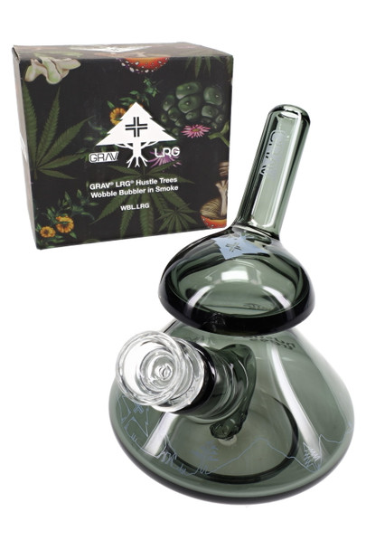 Front view of smoke-gray Hustle Trees wobble bubbler showing GRAV logo, mushroom dome and wobble base; premium head-shop glass on white.