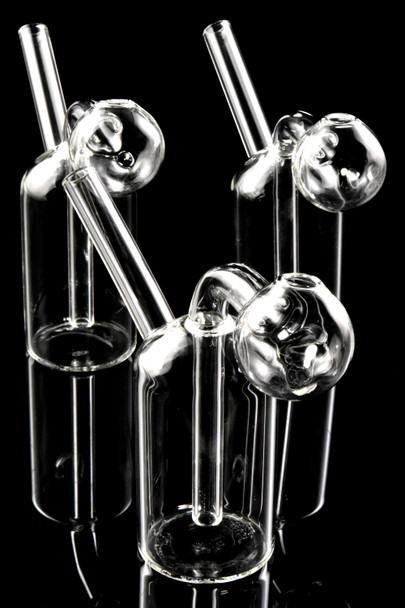 Trio of clear mini oil burner rigs on black background, compact B2B smoke shop supplies assortment photo