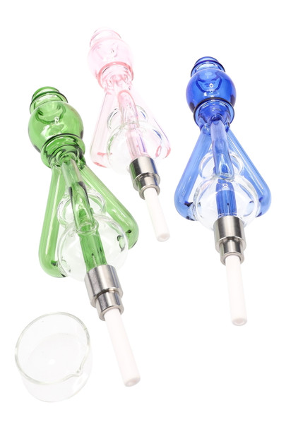Trio of recycler glass dab straws in green, pink, and blue with ceramic tips and quartz dish, wholesale head-shop kit, overhead three-quarter studio angle. Trio of recycler glass dab straws in green, pink, and blue with ceramic tips and quartz dish, wholesale head-shop kit, overhead three-quarter studio angle.