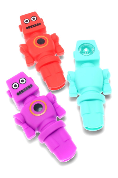 Trio of robot-shaped silicone hand pipes in teal, red, and purple with glass bowl insert, 4.5" compact size, angled studio shot for wholesale head-shop buyers.