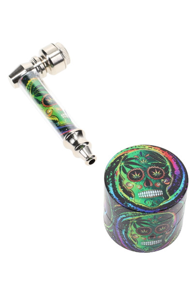 Metal pipe with sugar-skull art and matching 1.5-in grinder, silver cap; studio white angle for wholesale gift-set listing. Metal pipe with sugar-skull art and matching 1.5-in grinder, silver cap; studio white angle for wholesale gift-set listing.