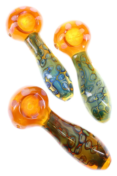 Three 5" gold-fumed glass spoon pipes with bubble texture and color-changing bowls, assorted tones, top-down angle for wholesale displays. Three 5" gold-fumed glass spoon pipes with bubble texture and color-changing bowls, assorted tones, top-down angle for wholesale displays.