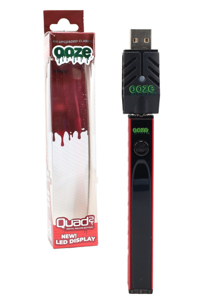 Ruby Red Ooze Quad 2 battery shown beside packaging with Ooze Smart USB charger attached