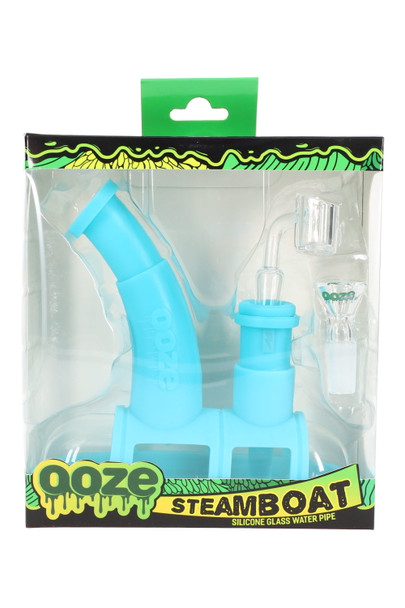 Ooze Steamboat silicone and glass water pipe set, assorted variant in retail display box showing components and branding, front view for retailers. Ooze Steamboat silicone and glass water pipe set, assorted variant in retail display box showing components and branding, front view for retailers.