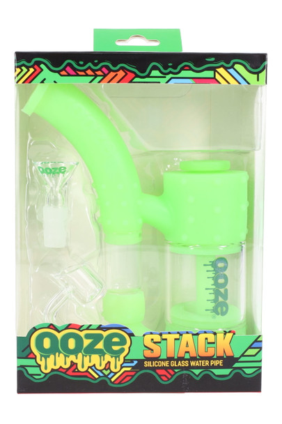 Green Glow Ooze Stack silicone/glass water bubbler packaged in display-ready box, components shown, front view for retail smoke-shop wholesale. Green Glow Ooze Stack silicone/glass water bubbler packaged in display-ready box, components shown, front view for retail smoke-shop wholesale.