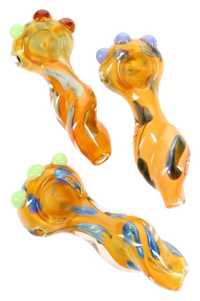 Trio of 4" gold-fumed color-changing twisted spoon pipes with dotted bowls and green/blue marble accents, studio top view for wholesale head-shops. Trio of 4" gold-fumed color-changing twisted spoon pipes with dotted bowls and green/blue marble accents, studio top view for wholesale head-shops.