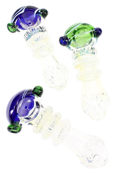 Three 5" color-changing glass spoon pipes with striped bowls and ridged rings, blue and green accents; wholesale head-shop photo, angled top view. Three 5" color-changing glass spoon pipes with striped bowls and ridged rings, blue and green accents; wholesale head-shop photo, angled top view.
