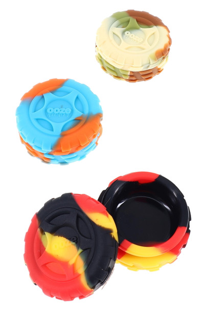 Bulk silicone tire concentrate jars, assorted swirl colors, 8 ml non-stick interior, one jar open, overhead view Bulk silicone tire concentrate jars, assorted swirl colors, 8 ml non-stick interior, one jar open, overhead view