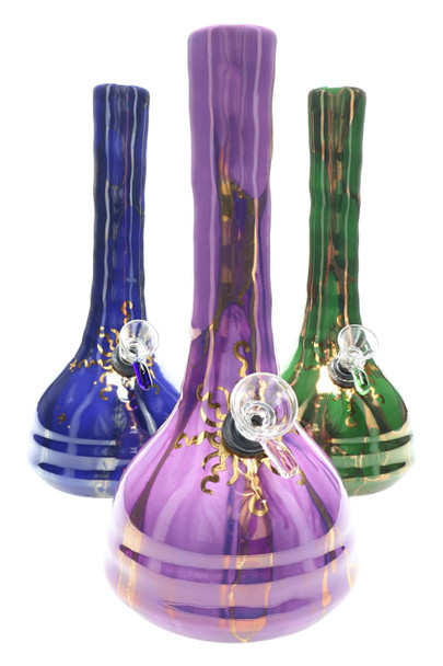 Wholesale 9-inch ceramic water pipes in purple, blue and green glazes with 22 k gold sunburst artwork and beaker bases, front trio showcase view. Wholesale 9-inch ceramic water pipes in purple, blue and green glazes with 22 k gold sunburst artwork and beaker bases, front trio showcase view.