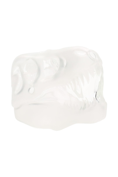 Frosted glass T-Rex skull dinosaur hand pipe on white background, side profile hero shot for smoke shop wholesale product listings.