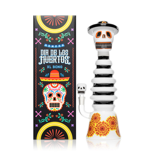 Hemper Dia De Los Muertos XL skeleton bong beside festival box, front view on white for wholesale smoke shop listings.