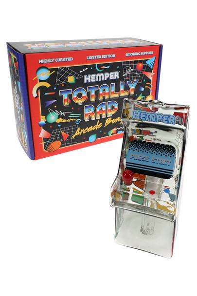 Hemper Totally Rad Arcade mini bong shown beside its branded retail box, compact novelty water pipe photo aimed at head-shop buyers stocking themed glass.