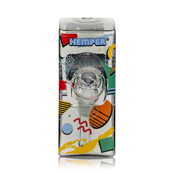 Front view of Hemper Totally Rad arcade glass bong showing clear herb bowl, Hemper logo and bold geometric graphics, detailed shot for head-shop buyers.
