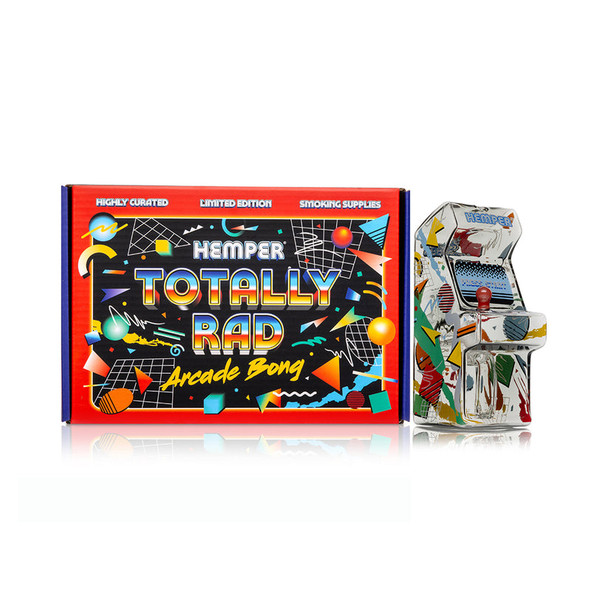 Hemper Totally Rad Arcade Bong posed beside matching retro neon display box with grid and shapes, shelf-ready novelty water pipe for retail smoke shops.