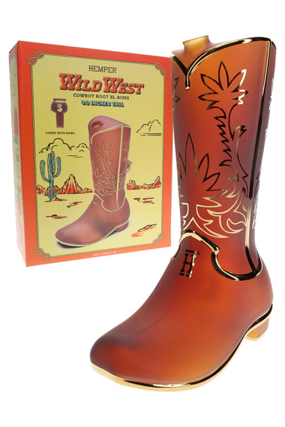 Hemper Wild West cowboy boot XL bong in frosted amber standing beside yellow desert-themed box, shelf-ready novelty water pipe for head-shop buyers.