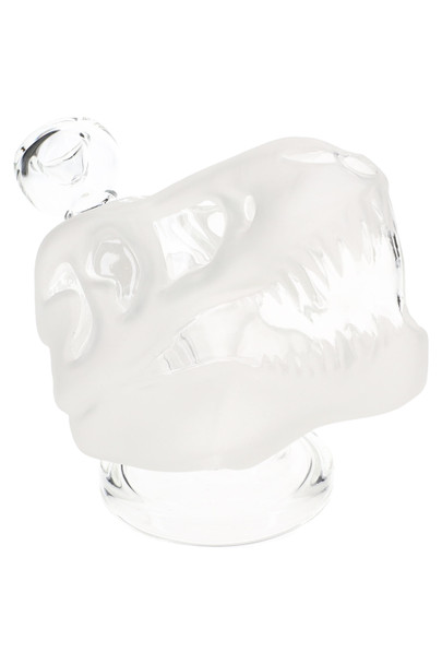 Frosted 4.5" Hemper Jurassic Spark dinosaur skull glass bong on clear base, side angle studio view for wholesale smoke shop water pipe catalogs.