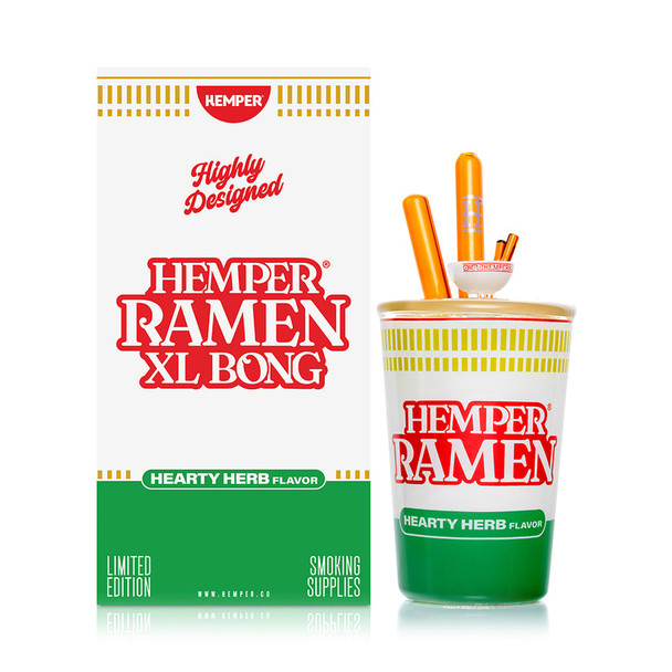 Hemper Ramen Cup XL Bong posed next to white and green “Hemper Ramen XL Bong” gift box, front hero shot for B2B glass bong product catalogs.