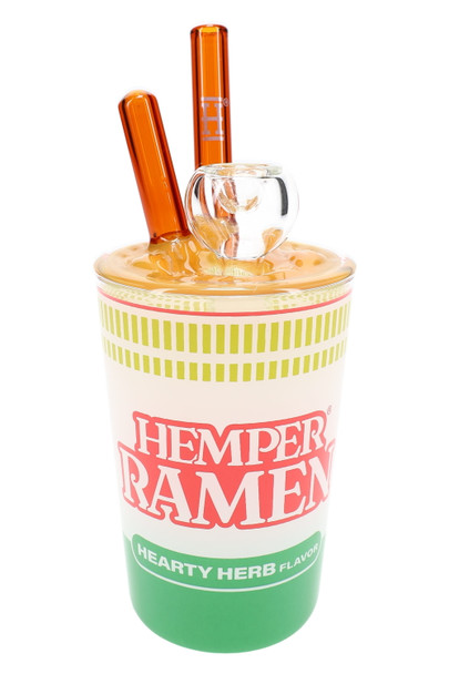 Clear 7" Hemper Ramen Cup glass bong with opaque yellow noodle lid and amber chopstick mouthpiece, full product photo on white for smoke shop wholesale buyers.