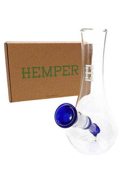 Hemper 7" Vase bong with blue downstem displayed in front of brown Hemper logo box, shelf-ready neutral water pipe setup for head-shop buyers planning inventory.