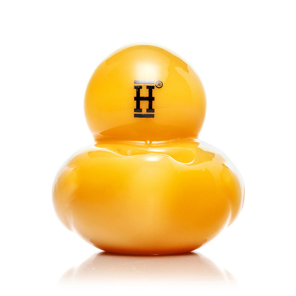 Back view of yellow duck-shaped glass hand pipe with Hemper “H” logo, showcase-ready wholesale item