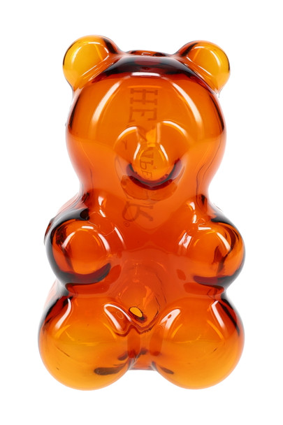 Front view amber gummy bear glass hand pipe with molded ears and paws, head-shop supplies product photo