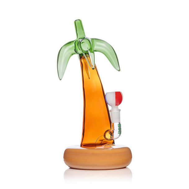 Side profile of palm tree bong with green fronds top and amber trunk, bowl installed—wholesale smoke shop gear