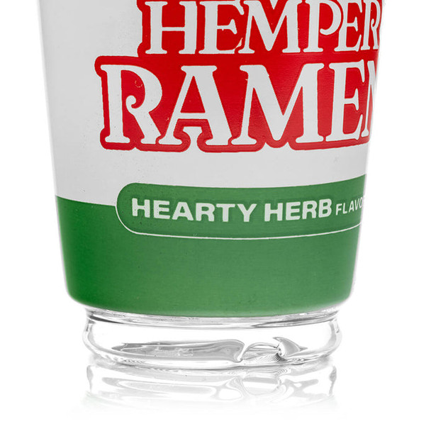 Close-up of Hemper Ramen logo and thick clear base on glass top—B2B catalog detail for accessory wall