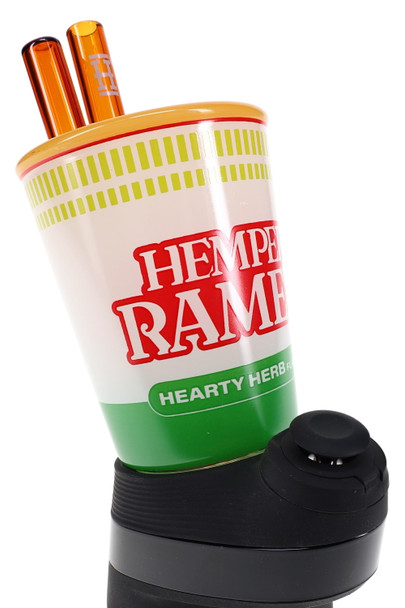 Hemper Ramen cup Peak glass top close-up, orange straw mouthpieces and green label—head shop supplies