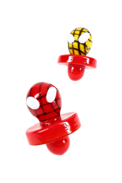 Two Spider Hero glass carb caps in red and yellow, floating angle—wholesale dab accessory for showcase add-ons